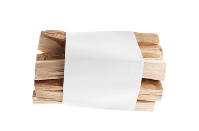 Photo of Palo santo sticks wrapped in paper on white background