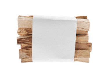 Photo of Palo santo sticks wrapped in paper on white background