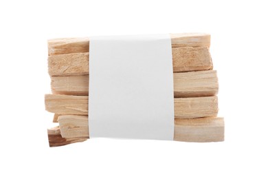 Photo of Palo santo sticks wrapped in paper on white background