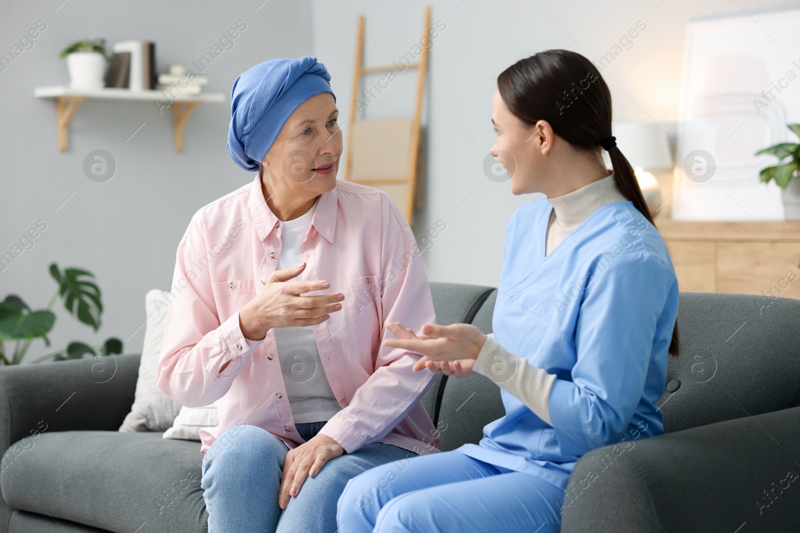 Photo of Woman with cancer and nurse at home