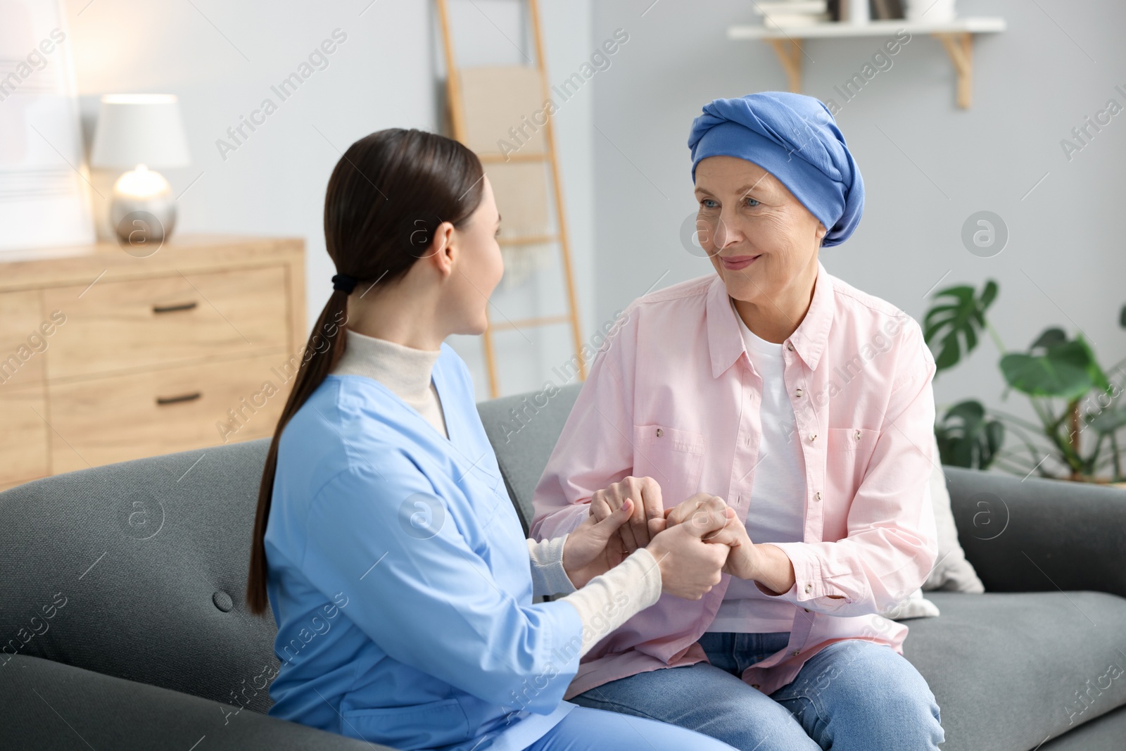 Photo of Woman with cancer and nurse at home