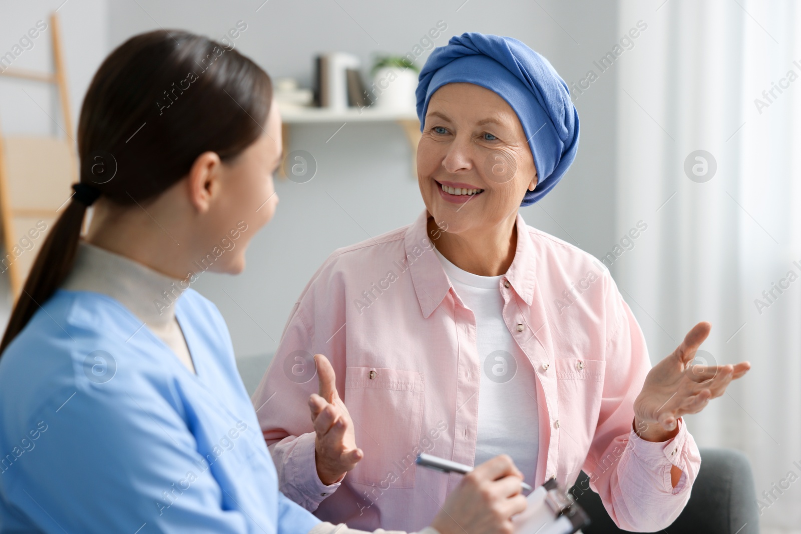 Photo of Woman with cancer and nurse at home