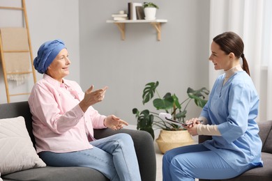 Photo of Woman with cancer and nurse at home