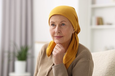 Portrait of senior woman with cancer at home