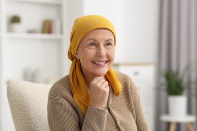 Portrait of senior woman with cancer at home