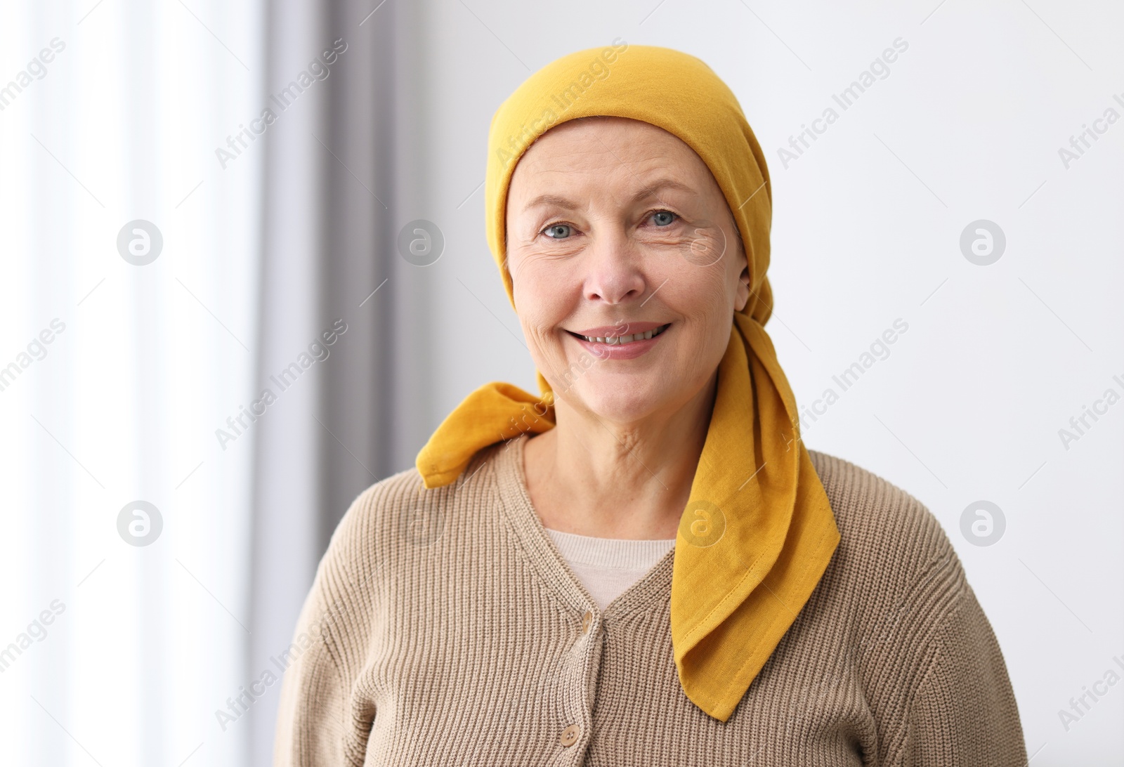 Photo of Portrait of senior woman with cancer at home