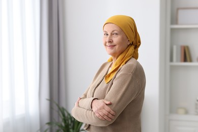 Portrait of senior woman with cancer at home