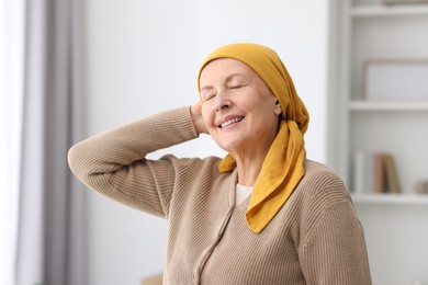 Photo of Portrait of senior woman with cancer at home