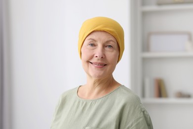 Portrait of senior woman with cancer at home