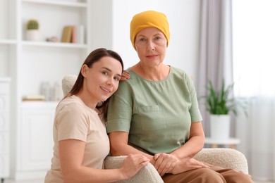 Photo of Woman with cancer and her daughter at home