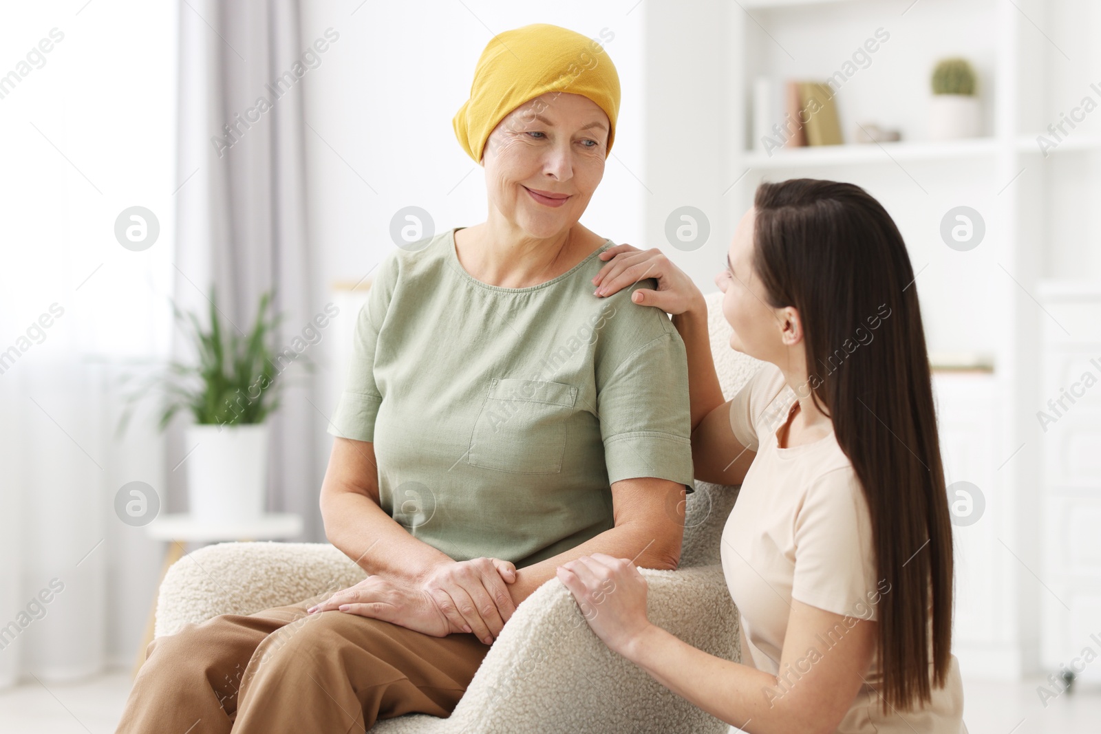 Photo of Woman with cancer and her daughter at home