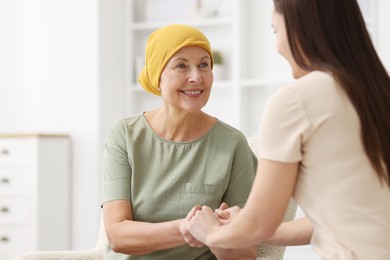 Woman with cancer and her daughter at home