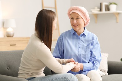 Photo of Woman with cancer and her daughter at home