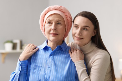 Photo of Woman with cancer and her daughter at home