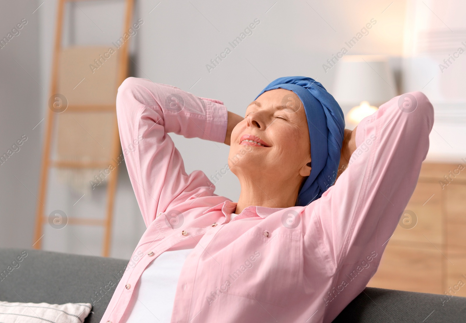 Photo of Senior woman with cancer on sofa at home