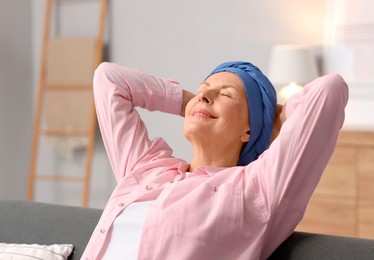 Photo of Senior woman with cancer on sofa at home