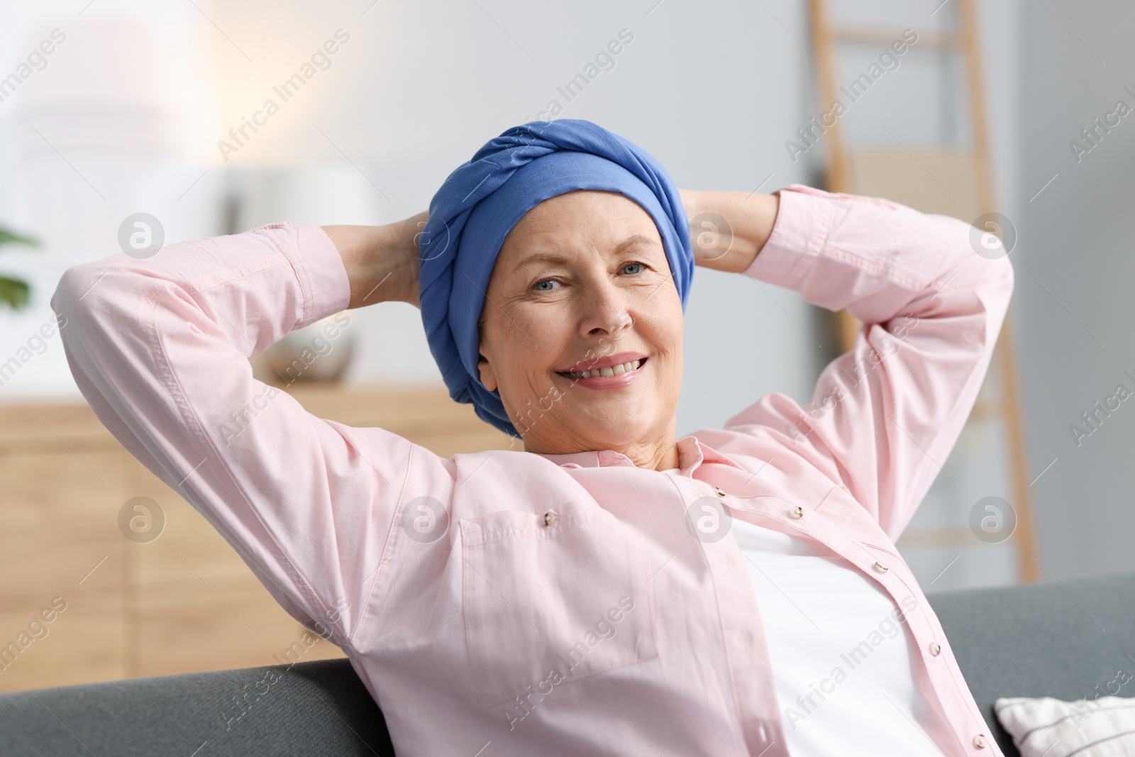 Photo of Senior woman with cancer on sofa at home