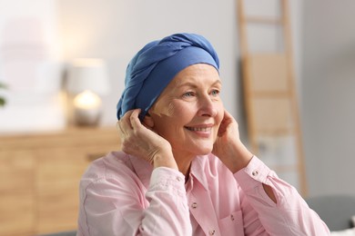 Photo of Portrait of senior woman with cancer at home