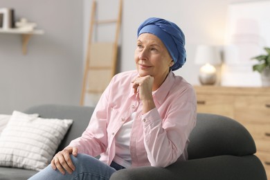 Photo of Senior woman with cancer on sofa at home