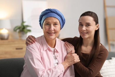 Photo of Woman with cancer and her daughter at home