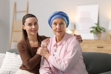 Photo of Woman with cancer and her daughter at home