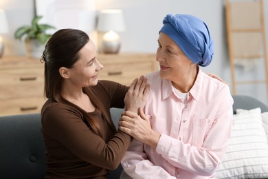 Photo of Woman with cancer and her daughter at home