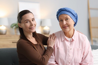 Woman with cancer and her daughter at home