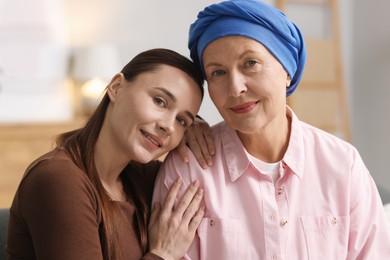 Photo of Woman with cancer and her daughter at home