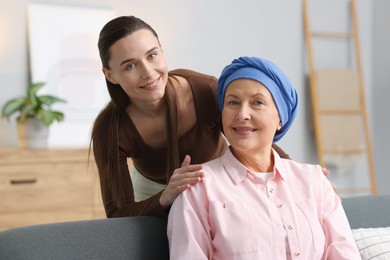 Photo of Woman with cancer and her daughter at home