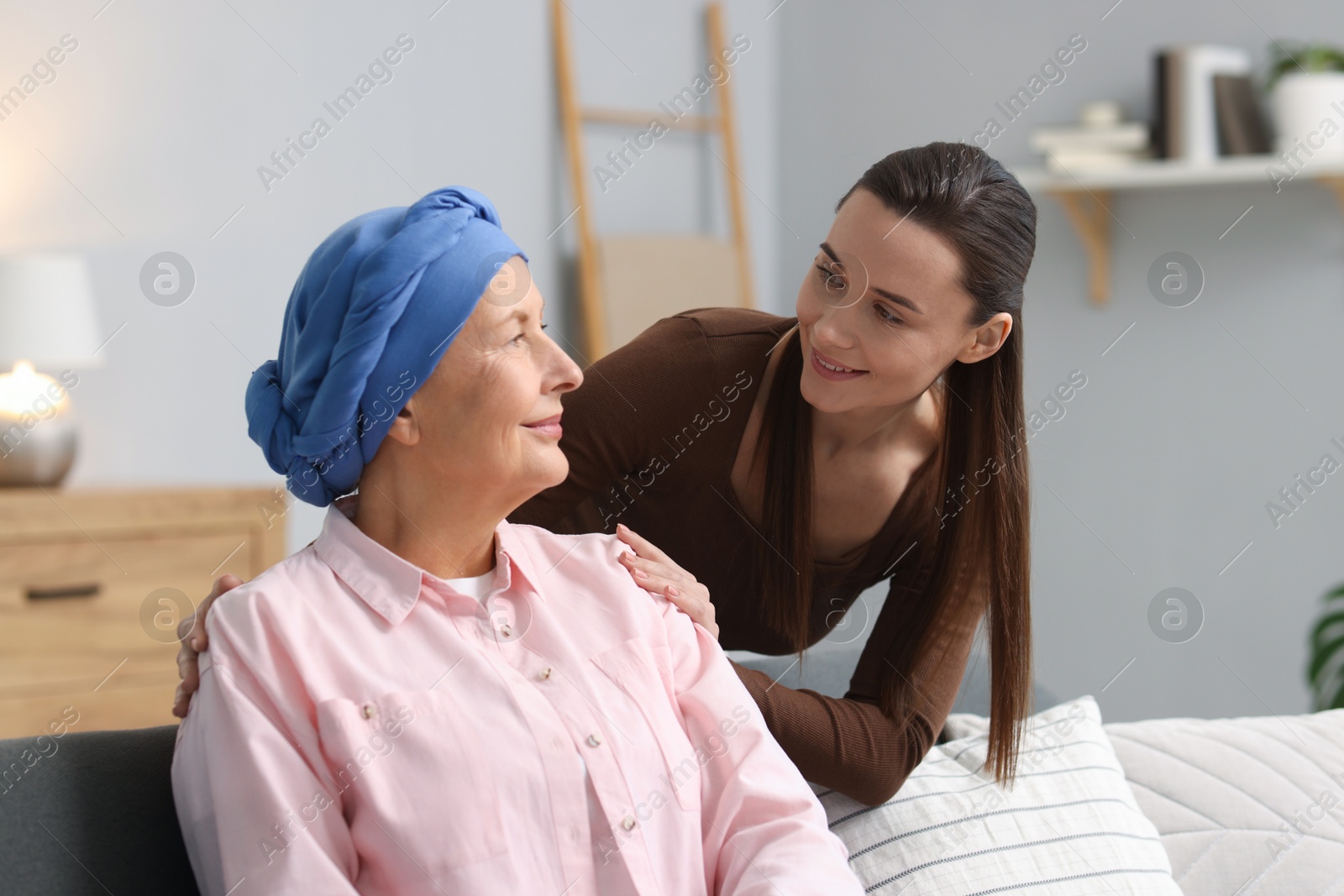 Photo of Woman with cancer and her daughter at home