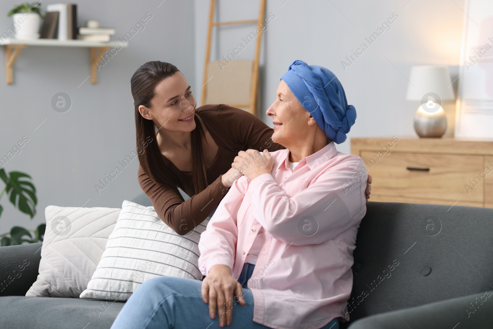 Photo of Woman with cancer and her daughter at home