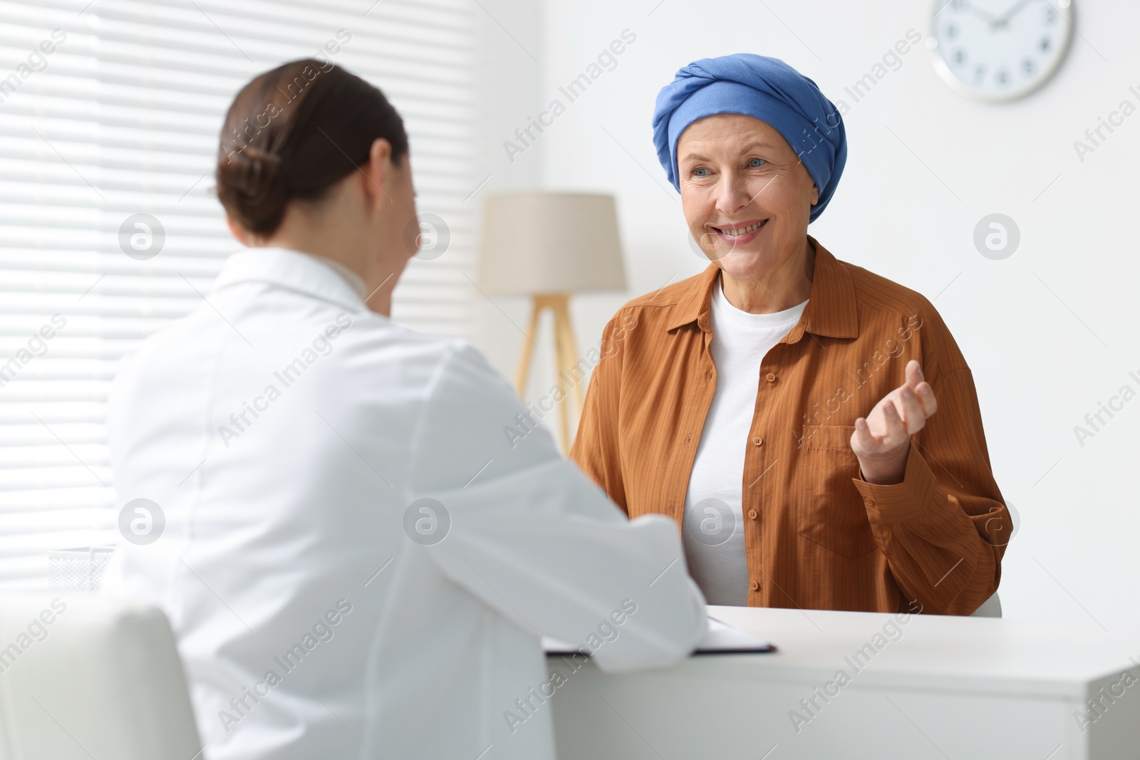 Photo of Senior woman with cancer visiting oncologist in clinic