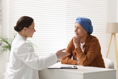 Photo of Senior woman with cancer visiting oncologist in clinic