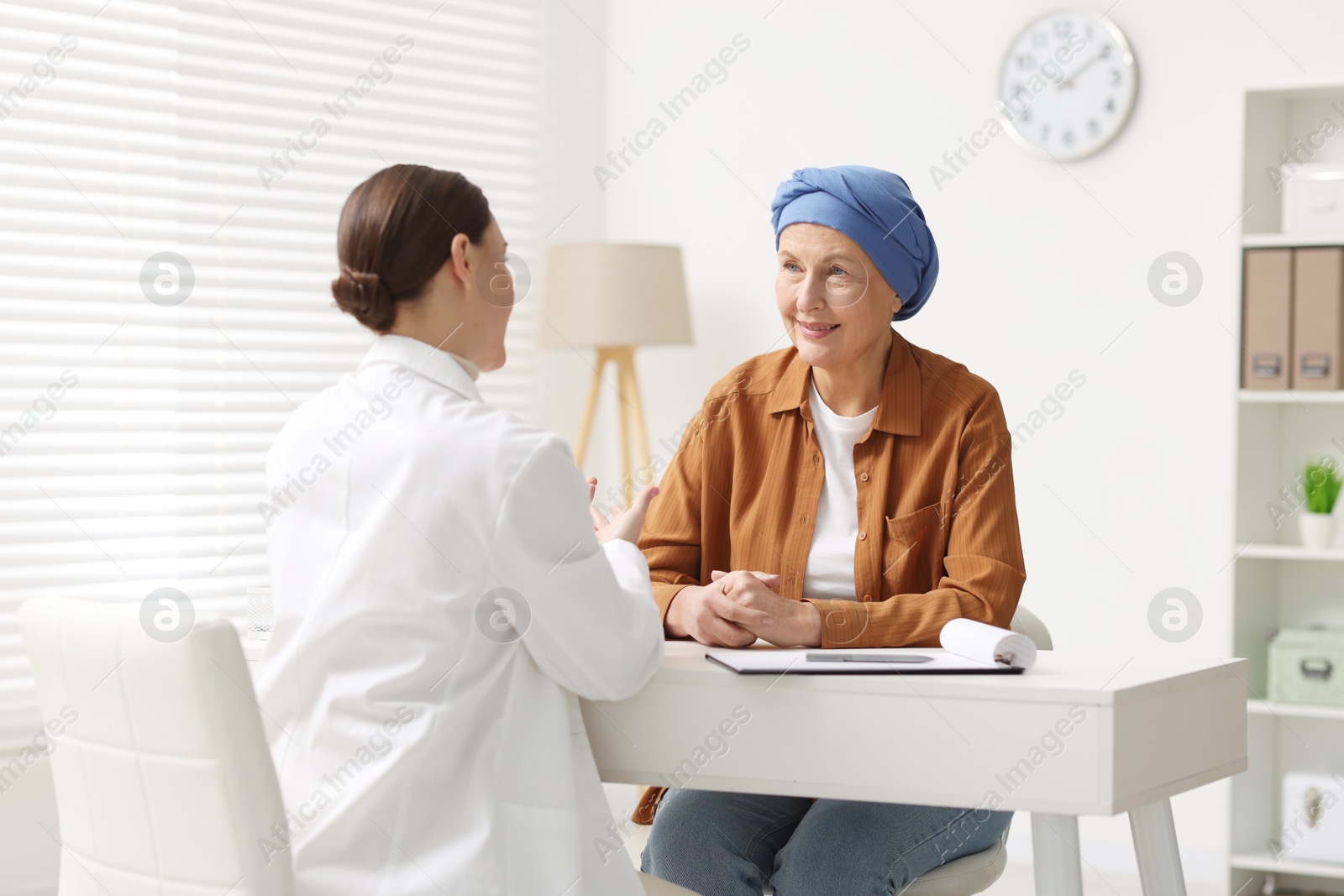 Photo of Senior woman with cancer visiting oncologist in clinic