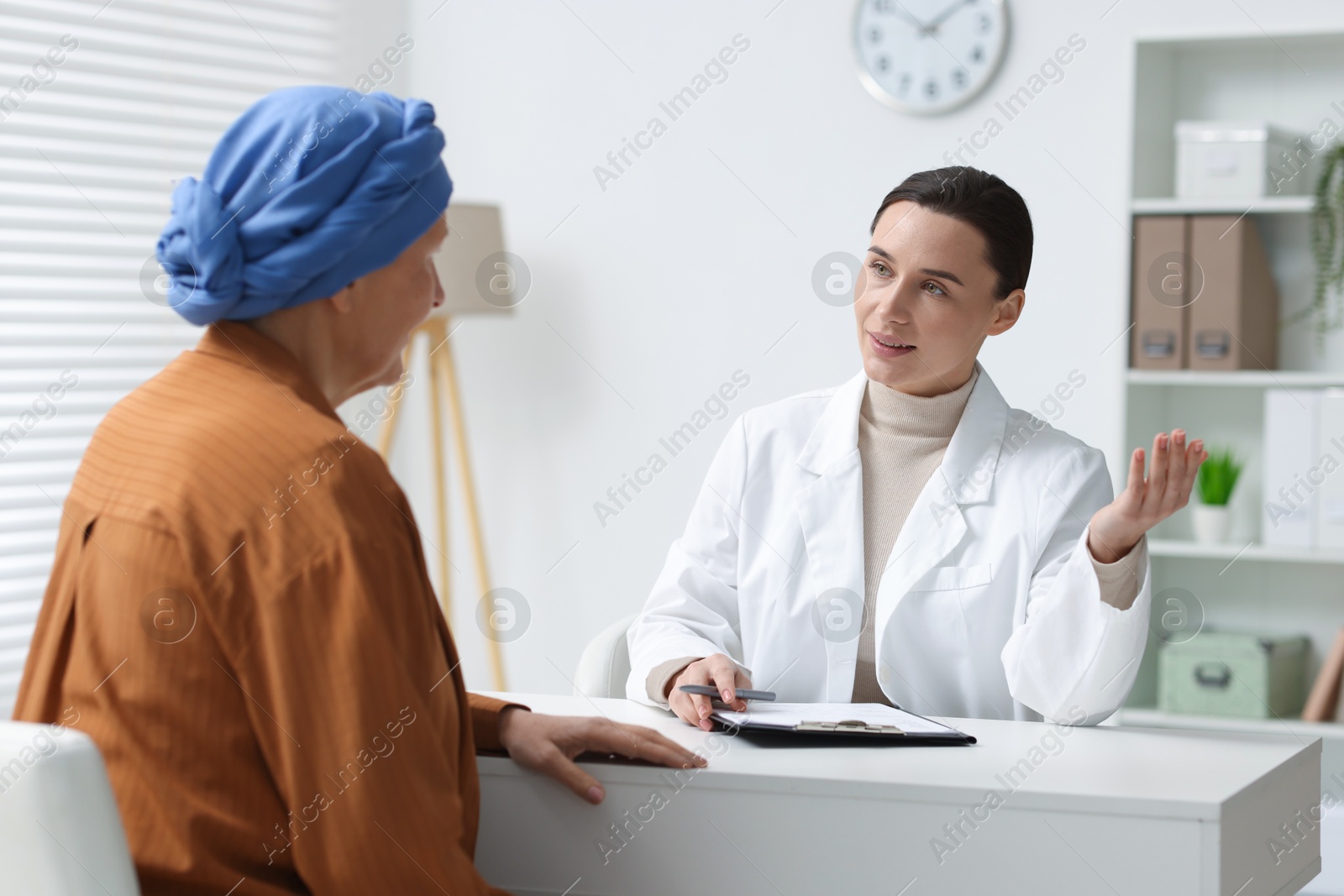 Photo of Senior woman with cancer visiting oncologist in clinic