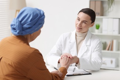 Photo of Senior woman with cancer visiting oncologist in clinic