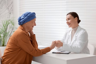 Photo of Senior woman with cancer visiting oncologist in clinic