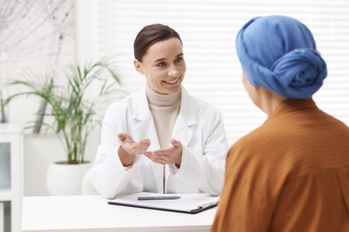 Photo of Senior woman with cancer visiting oncologist in clinic