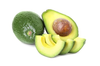 Photo of Whole and cut avocados isolated on white