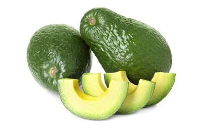 Photo of Whole and cut avocados isolated on white