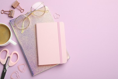 Photo of Paper clips, other different stationery, glasses and coffee on lilac background, flat lay. Space for text