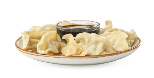 Photo of Tasty boiled gyoza (dumplings) with soy sauce on white background