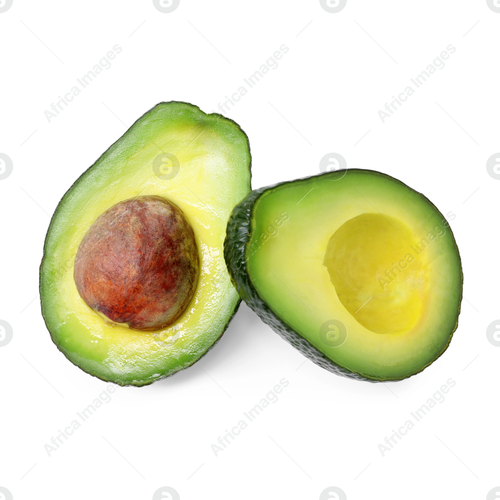 Photo of Halves of ripe avocado isolated on white, top view