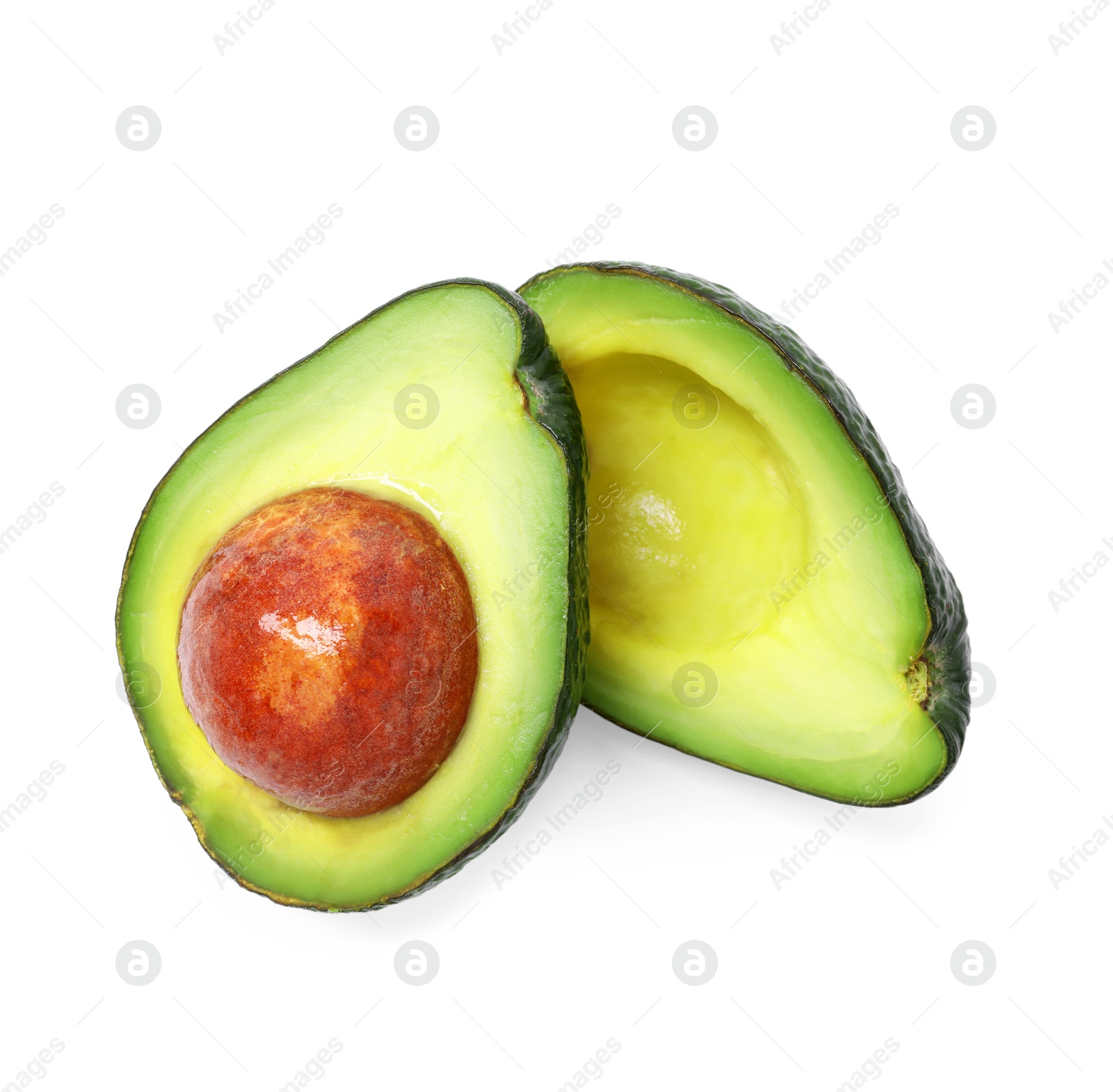 Photo of Halves of ripe avocado isolated on white, top view