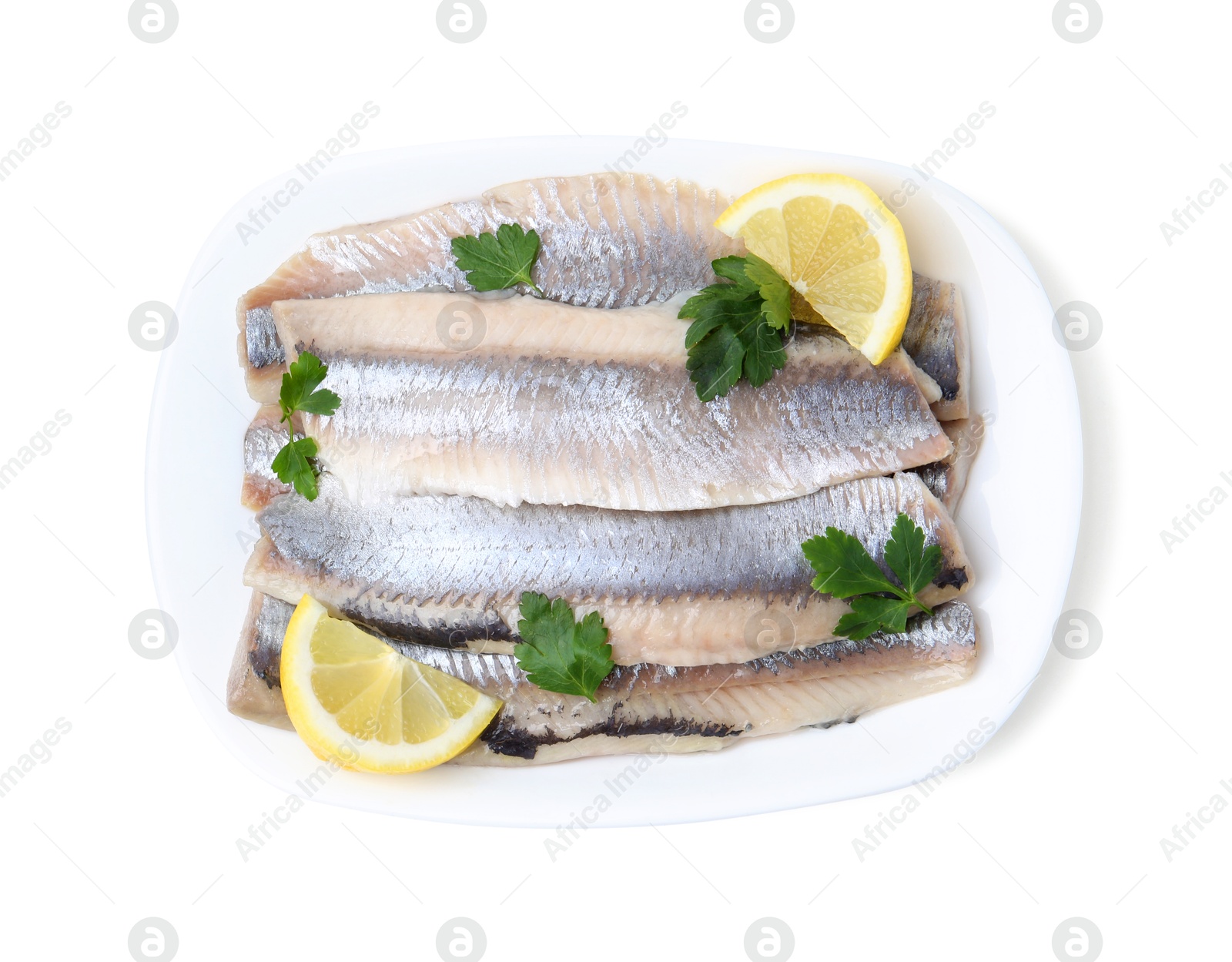 Photo of Marinated herring fillets with lemon and parsley isolated on white, top view