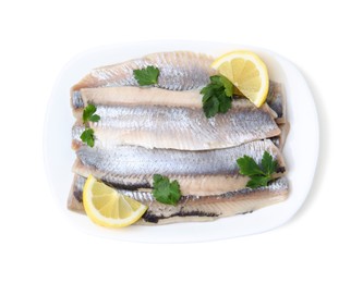 Marinated herring fillets with lemon and parsley isolated on white, top view