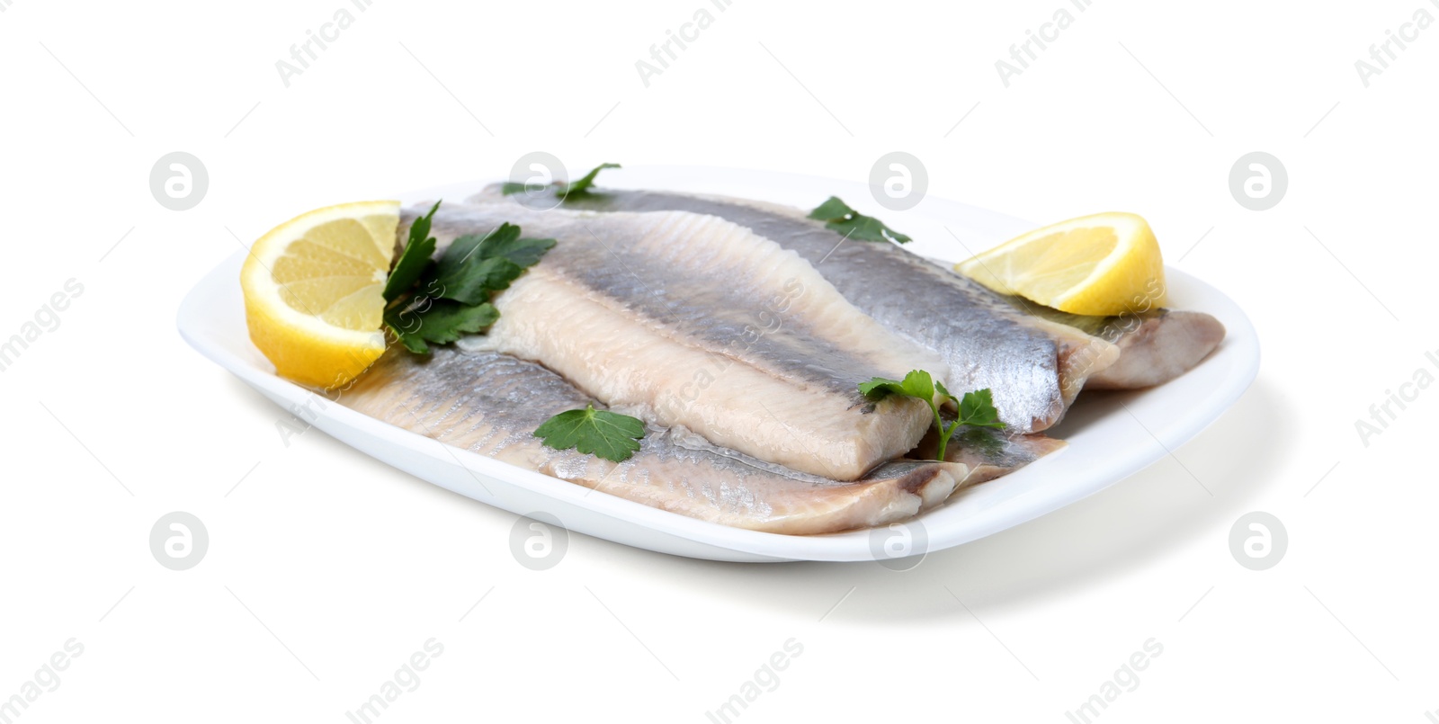 Photo of Marinated herring fillets with lemon and parsley isolated on white