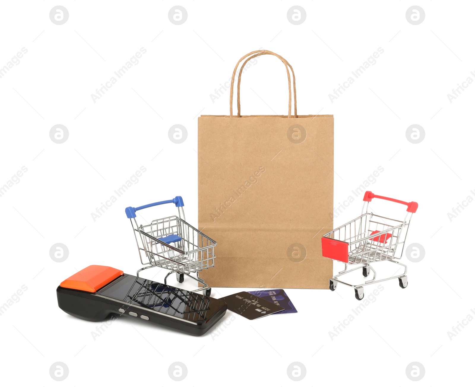 Photo of Payment terminal, credit cards, shopping bag and mini carts isolated on white