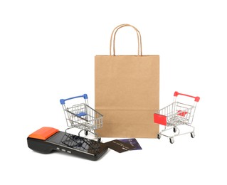 Payment terminal, credit cards, shopping bag and mini carts isolated on white