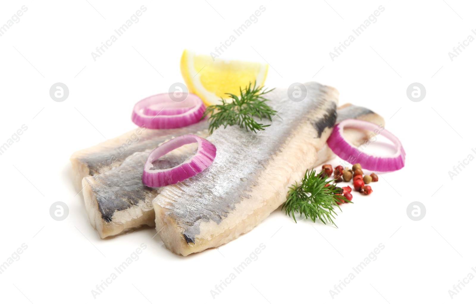 Photo of Marinated herring fillets with dill, onion rings, peppercorns and lemon isolated on white